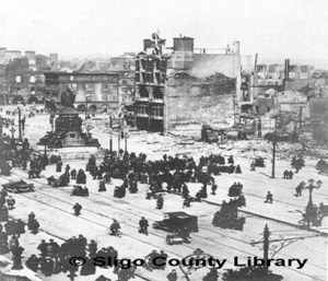 O'Connell St (then Sackvill St) from the Bridge looking north-eastwards. Destruction by bombardment of a major UK city shows determination of the British to crush the Rising.