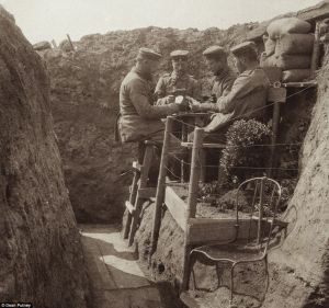 German soldiers playing cards during WWI. Photos of Germans in WWI more readily available show them wearing masks and looking like monsters.
