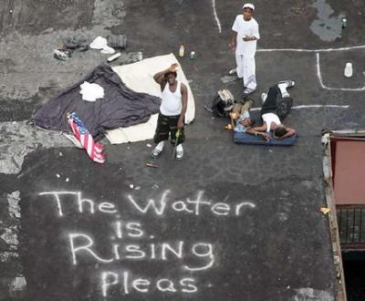 Hurricane Katrina victims in New Orleans signaling for help