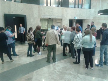 Some of the crowd of supporters welcome Bennet as he emerges into the court ground floor lobby. His daughter Saoirse can be seen the left holding Bennet's grandson. Unfortunately, Bennet himself is hidden by a supporter moving forward as photo was taken.