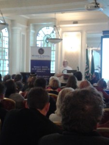 Frank Allen speaking from the podium 