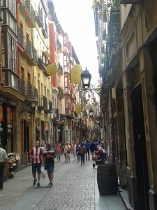 Street in the Casco Viejo medieval part of Bilbao, showing decorations for the Bilbo festival in August
