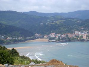 Mundaka coastline in Bizkaia province on south-eastern coast -- with mountains visible behind