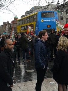 Small section of crowd on east pavement, O'Connell St, with Misneach organisation flags visible (Photo D. Breatnach) 