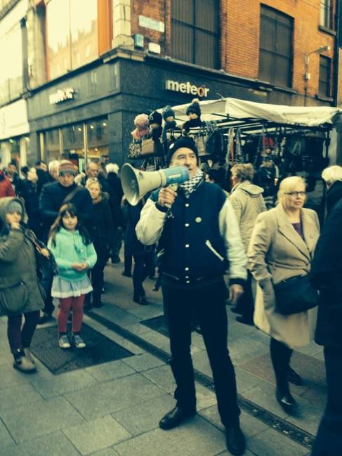 Diarmuid Breatnach, who gave the speech, earlier at the march, as it came down through Moore Street into Henry Street, heading for the GPO and the rally. Behind Diarmuid is the entrance to Henry Place, evacuation route of the GPO Garrison in 1916.