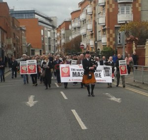 Lone piper leading march from Stoneybatter along North Brunswick Street