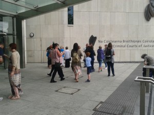 Some defendants and some supporters outside the court on the 13th