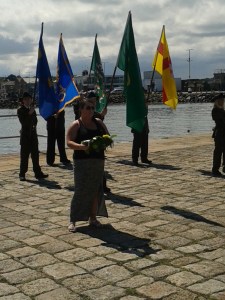 Denise Ní Chatháin bringing forth the wreath from the Anti-Internment Group of Ireland