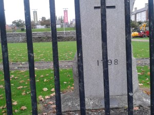 Memorial stone about halfway along the the Liffeyside of the park. In the distance, the heaped earth of works in October last year which had caused concern (Photo: D. Breatnach)