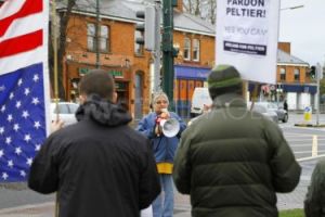 Jean-Ann speaking at picket on the US Embassy in Dublin in solidarity with Leonard Peltier. The photographer's back is to the Embassy.