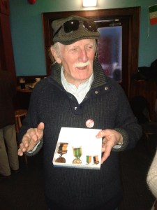 Joe Kelly displaying his father's 1916 service medal at a 1916 commemoration event (photo: D.Breatnach)