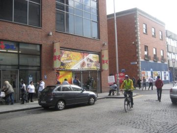 Part view of LIDL supermarket and junction of O'Rahilly Parade and Moore St.  Most of the market stalls begin from just past the dark blue hoarding at the right of photo.  (source: Internet)