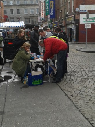 A knot of people gather to sign the petition in Moore Street (photo: D.Breatnach)