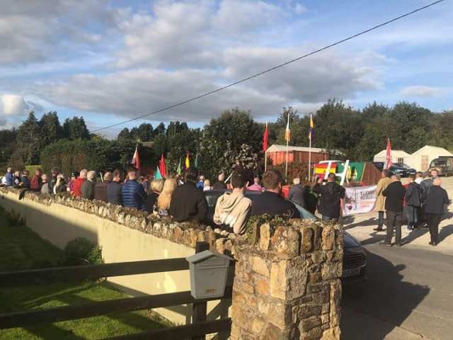 Monagear Commemoration from behind wall